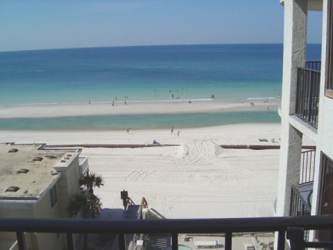 1986 Ford Bronco - A wide shot of a beach with people enjoying the water and sand, viewed from a balcony.