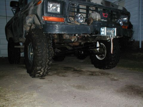1979 Ford Bronco - Front view of a modified 1979 Ford Bronco with off-road tires and a winch installed.