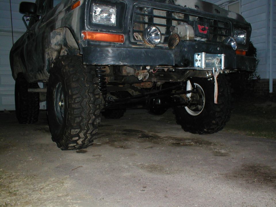 1979 Ford Bronco front end with large off-road tires and winch