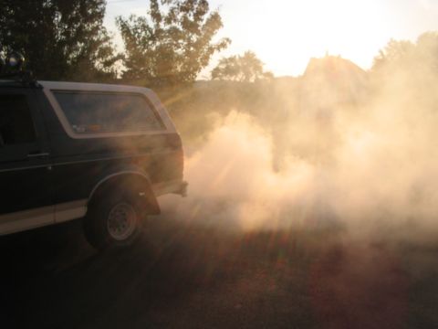 1992 Ford Bronco - A 1992 Ford Bronco kicks up a cloud of smoke during a burnout.