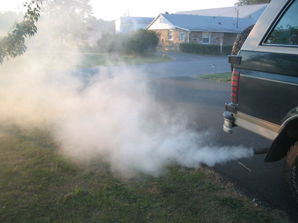 1992 Ford Bronco rear view with heavy white exhaust smoke