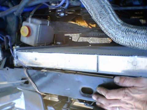 1986 Ford Bronco - Close-up view of a vehicle's radiator and engine components.