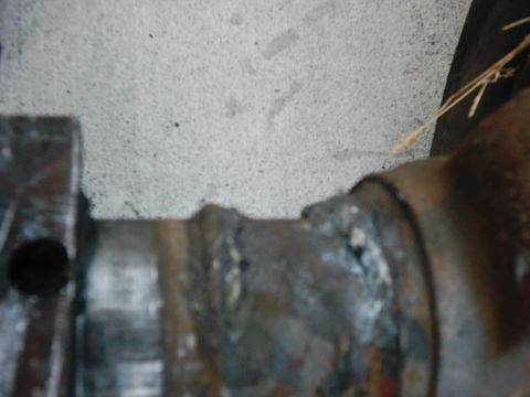 1978 Ford Bronco - A close-up view of a corroded metal part, possibly from a vehicle's undercarriage.
