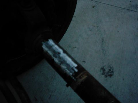1978 Ford Bronco - Close-up of a driveshaft, possibly undergoing repair or modification.