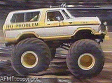 1993 Ford Bronco - This modified truck features oversized tires and custom paint, suggesting it's built for off-road performance.