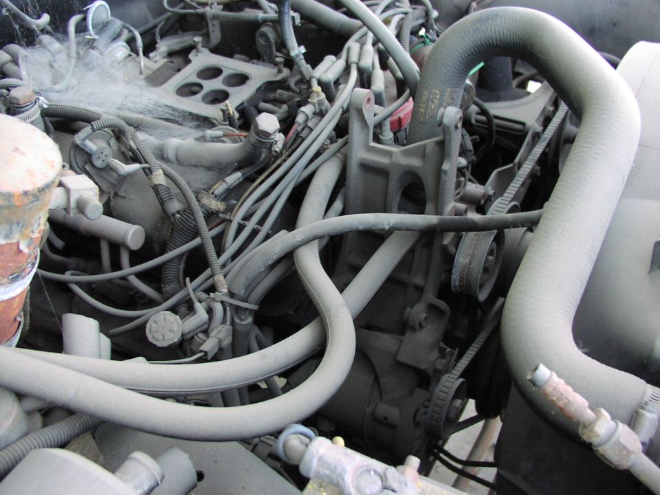 Engine bay with hoses and wiring