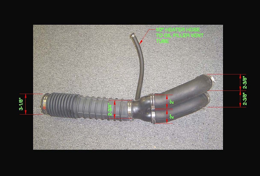 Rubber air intake tube with red measurement callouts and heater hose vent label