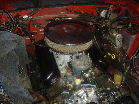 1986 Ford Mustang - Engine bay detail with V8 engine components visible, including air cleaner and distributor.