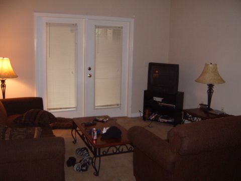 1988 Ford Bronco - A living room scene with furniture and double doors is depicted.