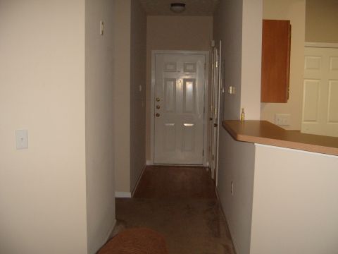 1988 Ford Bronco - This image shows an interior hallway leading to a closed door, with a counter on the right side.