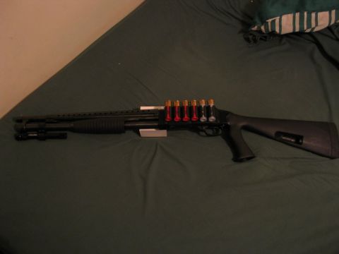 1995 Ford Bronco - Shotgun with a side saddle ammunition carrier and barrel-mounted flashlight.