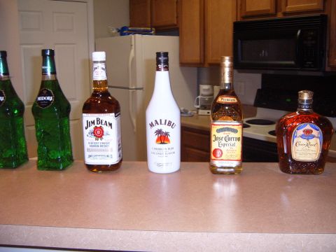 1988 Ford Bronco - A collection of alcoholic beverages sits on a kitchen counter, ready for a party.