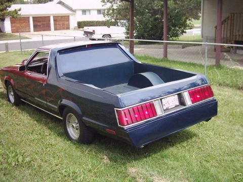 1970 Ford Ranchero - This Ford Ranchero features a custom paint job and a clean bed, seen from a rear-quarter angle.