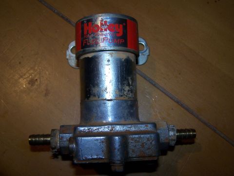 1979 Ford F-150 - A Holley electric fuel pump is shown, with visible text indicating its brand and function.