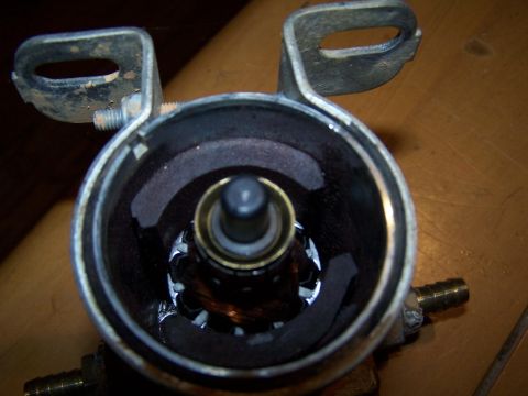 1979 Ford F-150 - Internal view of an automotive component, revealing copper windings and a central shaft mechanism.