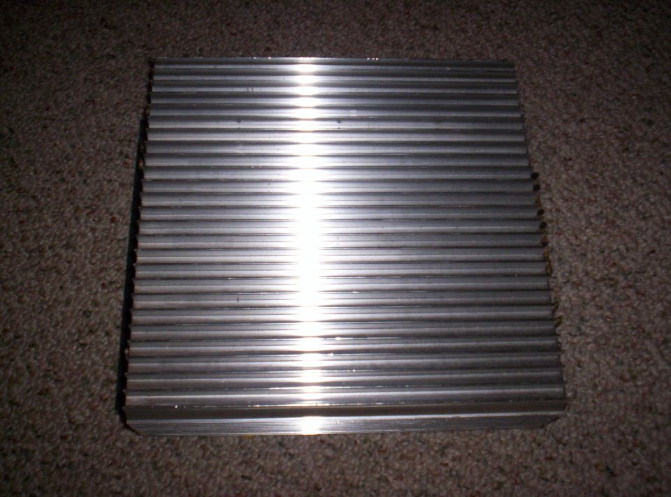 Rectangular aluminum heat sink with many horizontal fins
