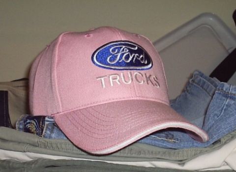 1989 Ford Bronco - A pink Ford Trucks baseball cap is shown with clothing items in the background.