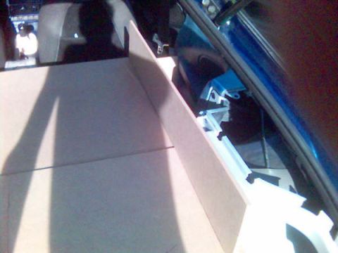 1994 Ford Probe - Custom wood paneling installed in the trunk of a car, with visible blue interior trim and a Supermotors.net watermark.