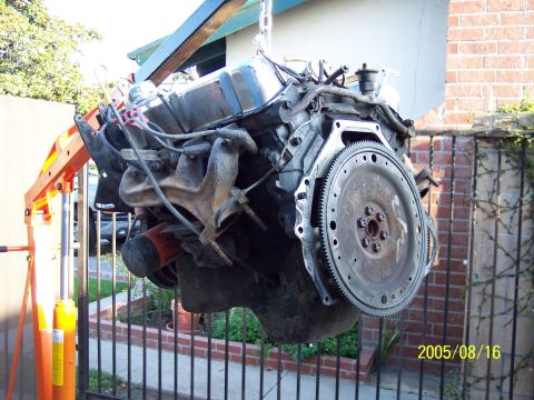 1985 Ford Bronco - Engine assembly is being lifted by an engine hoist. The date stamp on the photo reads 2005/08/16.