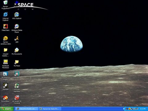 1997 Ford Taurus - Desktop wallpaper depicts Earth as seen from the lunar surface, with the moon's terrain in the foreground.