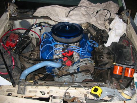 1985 Ford Crown Victoria LTD - The engine bay of a vehicle, showing the motor and associated components.