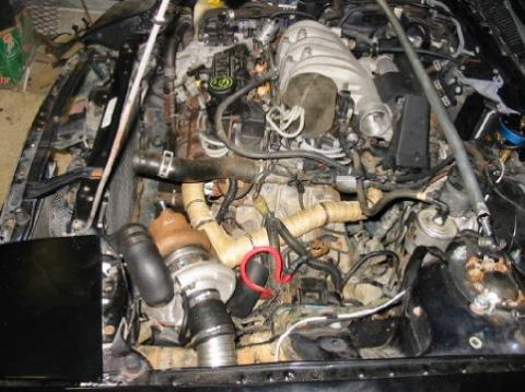 1992 Ford Probe - Engine bay components, including a turbocharger, are visible in this close-up view. The Supermotors.net logo is present at the bottom.