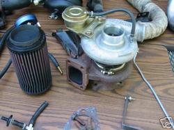 1992 Ford Probe - Turbocharger and air filter assembly with associated plumbing components.