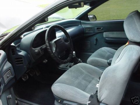 1992 Ford Probe - Interior view of a 1992 Ford Probe, grey cloth seats and a manual transmission.