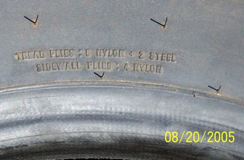 1979 Ford Bronco - Close-up of tire sidewall text indicating ply construction and a date stamp.