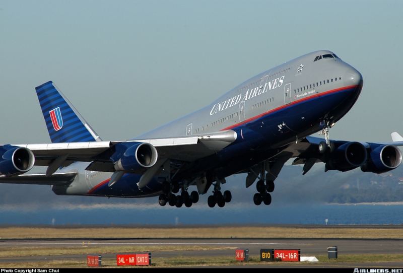 United Airlines Boeing 747 with landing gear down, taking off