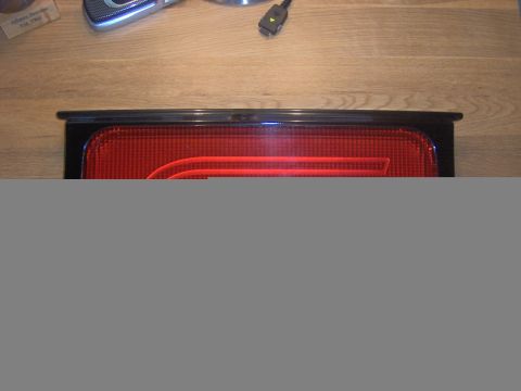 1994 Ford Probe - Close-up of a red car taillight assembly, likely a replacement part.