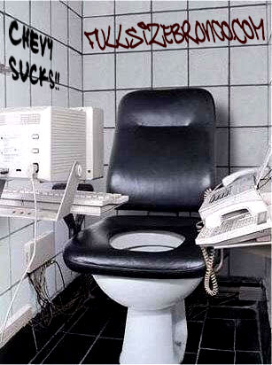 1993 Ford Bronco - A bizarre setup combines a toilet with office equipment, complete with graffiti on the wall.