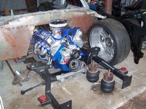 1979 Ford Bronco - Engine and chassis components laid out, possibly for a custom build or restoration project.