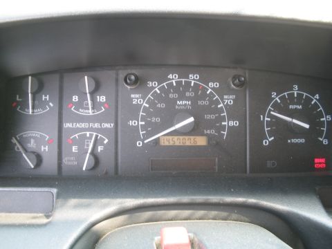 1992 Ford Bronco - Interior view of dashboard gauges, including speedometer, tachometer, fuel, and temperature gauges.