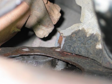 1995 Ford Bronco - The image shows heavily rusted metal parts, suggesting wear and tear on a vehicle component.