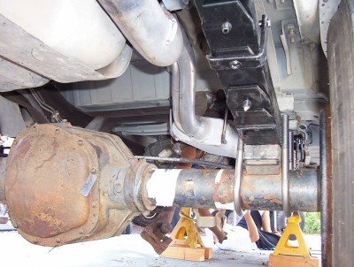 1995 Ford Bronco - Close-up view of the rear suspension and differential assembly of a vehicle.