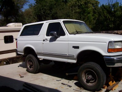 1995 Ford Bronco - This 1995 Ford Bronco is shown in a three-quarter front view, lifted on blocks.