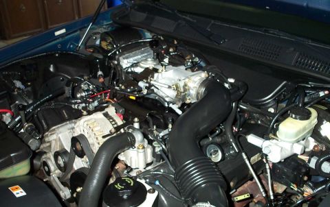 1998 Ford Crown Victoria - Close-up view of a vehicle's engine compartment, showing intricate mechanical details.