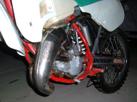 1985 Ford Bronco II - Detail shot of a motorcycle's engine and exhaust system, showing DynoJet branding.
