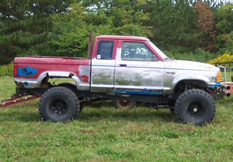 1979 Ford F-150 - This heavily modified pickup truck features oversized tires and a custom paint job, suggesting it's built for off-road use.