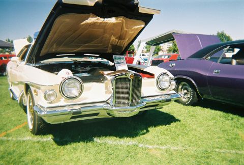 1972 Ford Ranchero - 1972 Ford Ranchero on display at an outdoor car show, hood raised to reveal the engine bay.