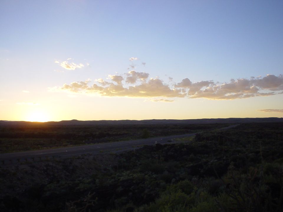 Sunset over a rural landscape with a road
