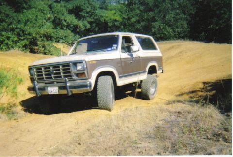 1982 Ford Bronco - This 1982 Ford Bronco is shown navigating a dirt trail with a lifted suspension.