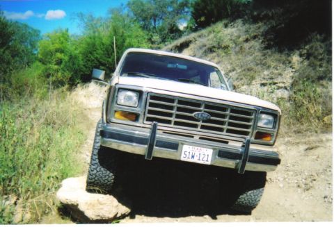 1982 Ford Bronco - This 1980 Ford Bronco navigates a challenging rocky path, its off-road capability.