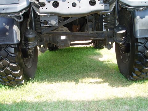 2000 Ford E350 - Close-up of the undercarriage and tires of a heavy-duty truck.