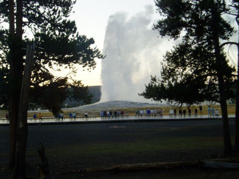 2000 Ford E350 - Tourists gather to witness the eruption of Old Faithful geyser in Yellowstone National Park.