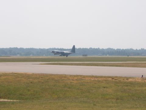 1988 Ford Bronco - An airplane is on the runway, preparing for takeoff or landing.