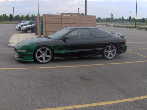 1994 Ford Probe - This 1994 Ford Probe features custom green flame graphics on its black paint.