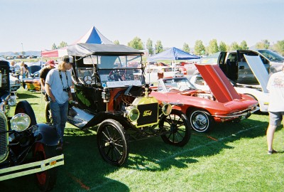 1972 Ford Ranchero - A vintage Ford Model T is displayed at an outdoor car show with other vehicles present.