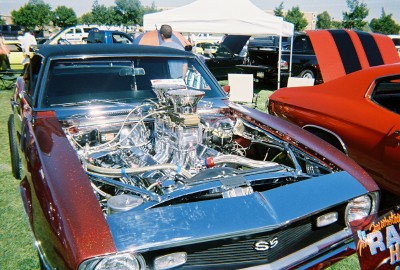 1972 Ford Ranchero - Customized 1969 Camaro SS at an outdoor car show, engine exposed and polished to a mirror finish.